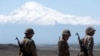 Armenia - Armenian soldiers taking part in a military exercise are pictured against the backdrop of Mount Ararat, May 26, 2022.