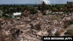 Зруйновані російською агресією будинки в місті Привіллі на Луганщині, 14 червня 2022 року