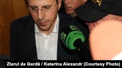 Chisinau Mayor Dorin Chirtoaca is escorted by anticorruption officers in Chisinau on May 25.