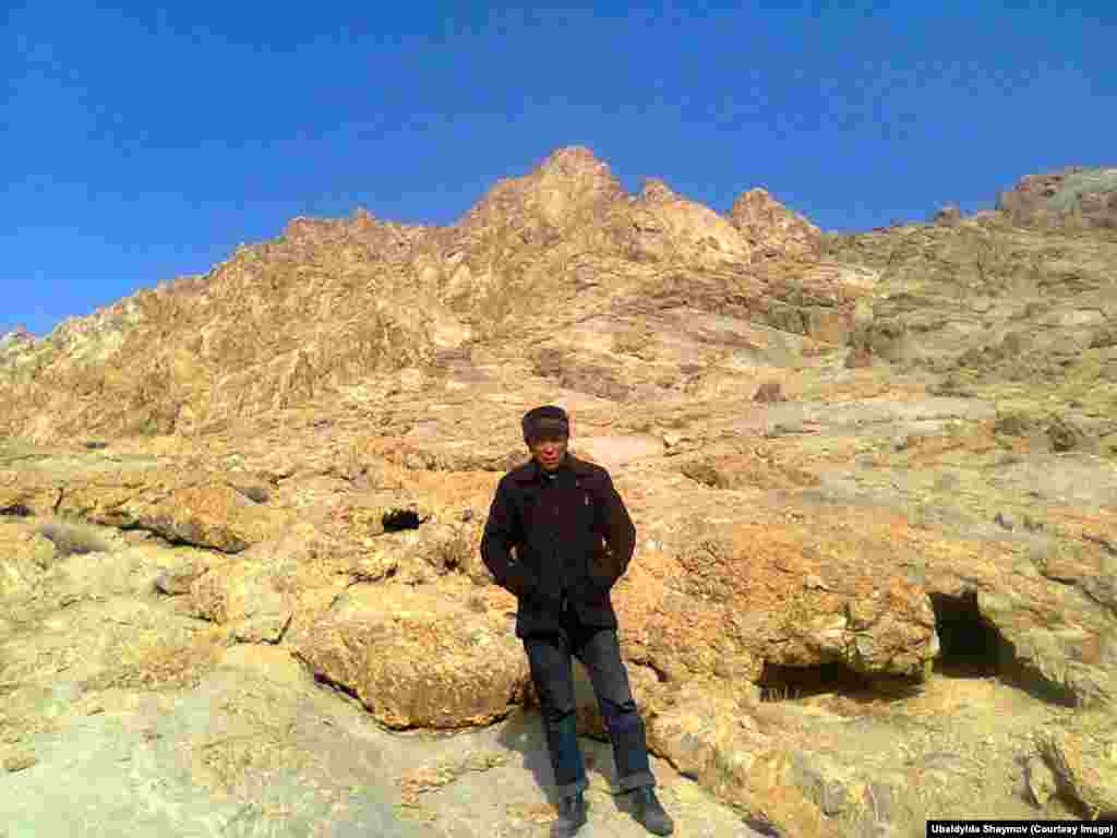 Ubaidylda Shaymov near the buriаl place for the victim of Stalinism near his village, Murghab