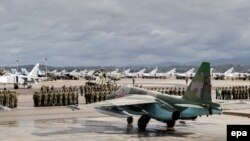 Торжественная церемония начала вывода российской авиационной группы из Сирии. 15 марта 2016 года.