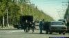 Russian police tend to a wounded officer during the fighting
