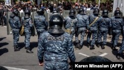 ARMENIA -- Armenian special police forces block a street during an opposition rally in central Yerevan, April 18, 2018
