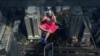 A girl observes a partial solar eclipse on the Mahanakhon Skywalk Glass Tray