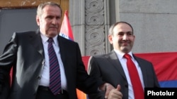 Armenia - Former President Levon Ter-Petrosian (L) and Nikol Pashinian greet supporters in Yerevan's Liberty Square, 31 May 2011.