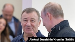 Аркадій Ротенберг та Володимир Путін