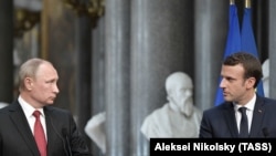 French President Emmanuel Macron (right) and Russian President Vladimir Putin give a joint press conference in Versailles in May 2017.
