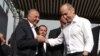 Armenia - Former President Robert Kocharian (R) greets Armen Charchian, director of the Izmirlian Medical Center, during a rally in Yerevan, May 9, 2021.
