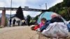 BOSNIA-HERZEGOVINA -- A group of more than 80 migrants from Asia and Africa besiege the gates of camp "Usivak", near Sarajevo, September 22, 2020
