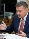 FILE PHOTO: Russian Minister of Transport Roman Starovoit attends a meeting with Russian President Vladimir Putin, in Moscow